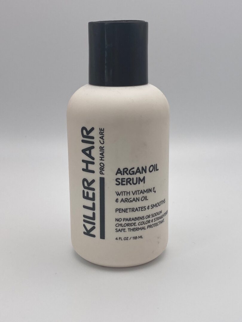A bottle of hair serum with argan oil.