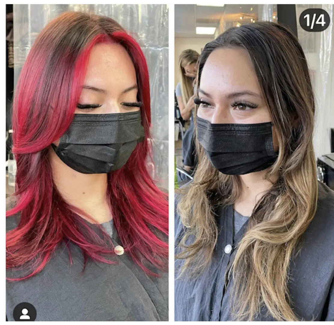 Two women with masks on and one is wearing a black mask